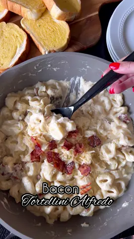 Bacon Tortellini Alfredo!🥓 10/10 delicious, easy weeknight meal that was picky-eater approved!! I think we all had to get seconds of this!😅 Used the recipe from @saltandlavender! Ingredients:  18 oz cheese tortellini (refrigerated package) 6 strips bacon (cut into small pieces) 1 clove minced garlic 1/4 cup chicken broth  1 cup heavy whipping cream 4 oz cream cheese  1 cup parmesan cheese Salt & Pepper  Directions:  1. Cook the bacon pieces in a large pan until done. Set aside and drain almost all of the grease.  2. Add garlic, chicken broth, heavy cream, and cream cheese to the pan. Stir together on low heat.  3. Cook the tortellini in a different salted pot while stirring together the sauce. (Only a few minutes)  4. Add the Parmesan and bacon to the sauce pan. Stir to combine.  5. Drain tortellini and toss into the pan. Mix till combined.  6. Season with salt and pepper  #weeknightmeals #EasyRecipes #weeknightdinner #schoolnights #easydinner #familydinner 