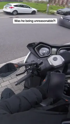 Mercedes driver demands biker move because he is taking a whole spot. Who is in the wrong here?