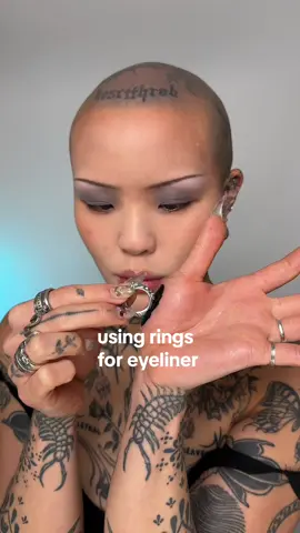 using my rings as a stamp for eyeliner! this is a relatively simple look but I’ve had the idea floating in my brain for a while #avantgardemakeup #editorialmakeup #graphicliner