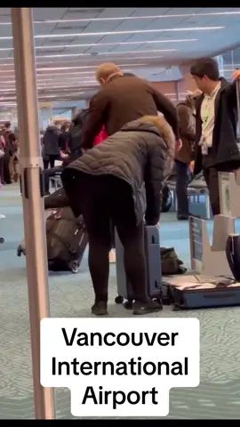 Irate passenger tries tobfit an oversized carryon bag inaide the size checker while calm cool and collected airline staff endures the drama. #Vancouver #YVR #Vancouver Airport #YVR dramz #Richmond 