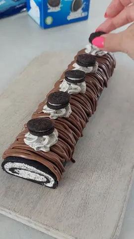 The most easy and delicious no bake oreo dessert!,  All you need to do is crush finely 300g oreo cookies take out 2 tbsp( for cream) Add 70ml milk and mix with spatula until dough firms. Put baking paper, oreo dough, and one more baking paper sheet on top and roll it out until around half cm thick.  for cream ,mix until smooth 270ml double cream, 1tbsp icing sugar and few drops of vanilla, mix until smooth, add 2 tbsp oreo biscuits and mix until combined, put cream on rolled oreo dough, spread it evenly.   roll up the dough and place it  in the freezer for 1 hour.   Drizzle with melted chocolate decorate with cream and oreo cookies, Absolutely delicious 😋  #oreodessert #nobakecake #asmrsounds #EasyRecipe #oreo 