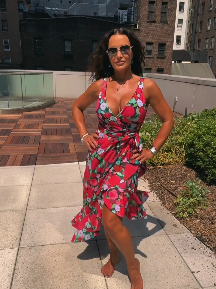 Bringing the heat from high above! ☀️🌇 Sun-kissed & sizzling on the rooftop in another sundress from my collection✨  #RooftopVibes #SundressSeason #SummerGlo #TheRealLisaAnn #NYC