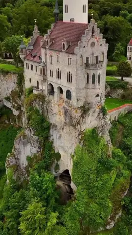 Lichtenstein Castle is a picturesque Gothic Revival castle situated on a cliff in the Swabian Jura of southern Germany, near the town of Lichtenstein in Baden-Württemberg. It was built in the mid-19th century by Count Wilhelm of Württemberg, inspired by Wilhelm Hauff's novel Lichtenstein. The castle features a dramatic design and offers stunning views of the surrounding countryside. Its location and architectural style have earned it the nickname 