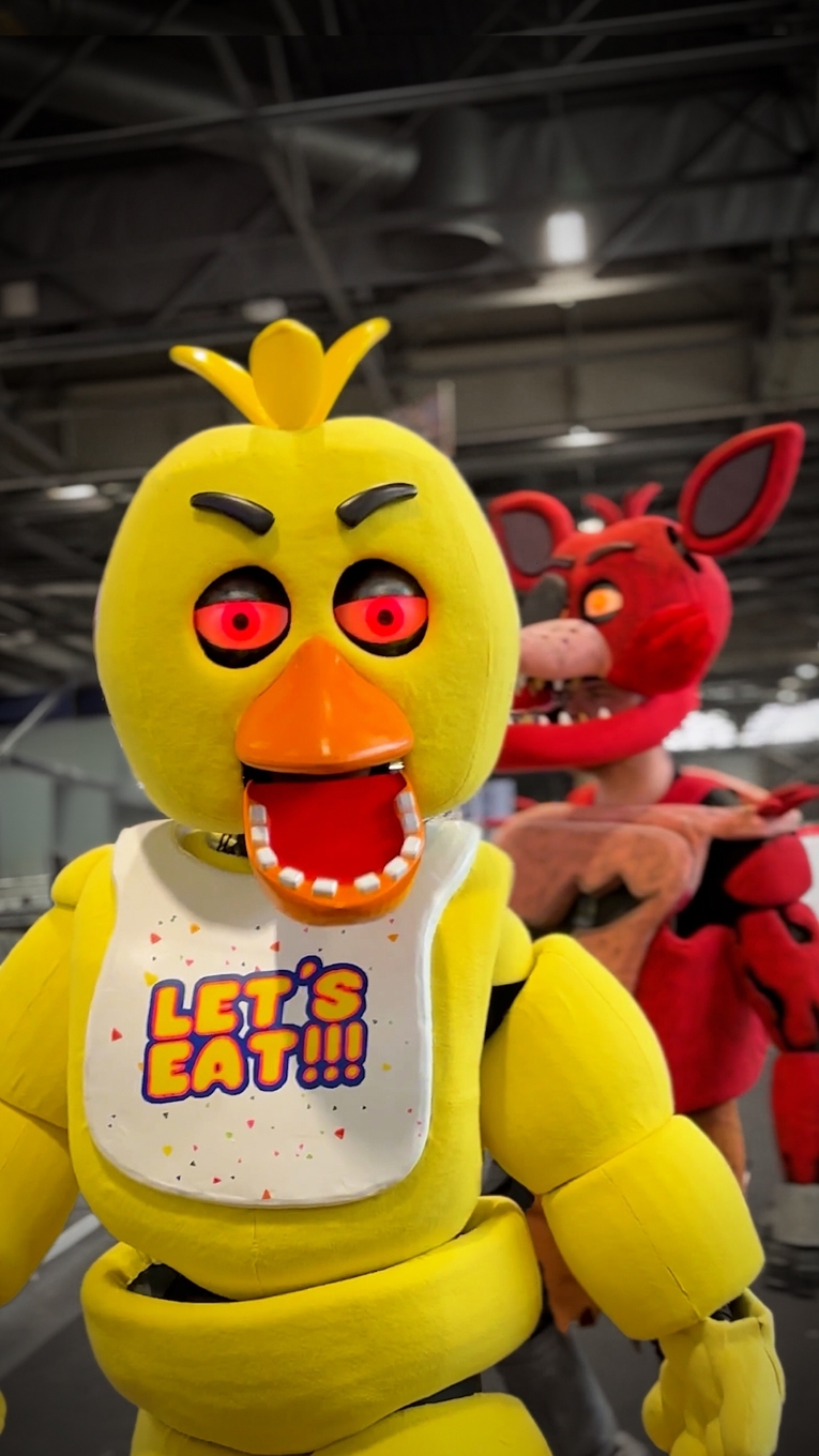 Foxy and Chica cosplay from the Five Nights at Freddy's movie (FNAF) recorded at Japan Expo Paris 2024 by Comic Con News In the Five Nights at Freddy's movie, Chica is one of the main animatronic characters. Known for her appearance as a chicken with a bib reading 