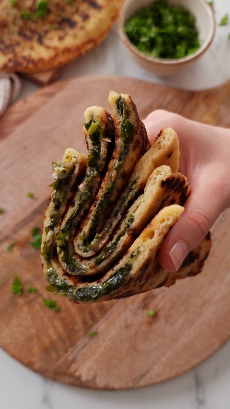 gluten-free stuffed flatbread 🤤🤌 I've made these 5 times just in the last week and I still can't get enough – I stuffed them with a mix of Swiss chard, parsley and cheese, but you can really use whatever ingredients you have on hand, and they're sooo easy to make!! #flatbread #glutenfree 
