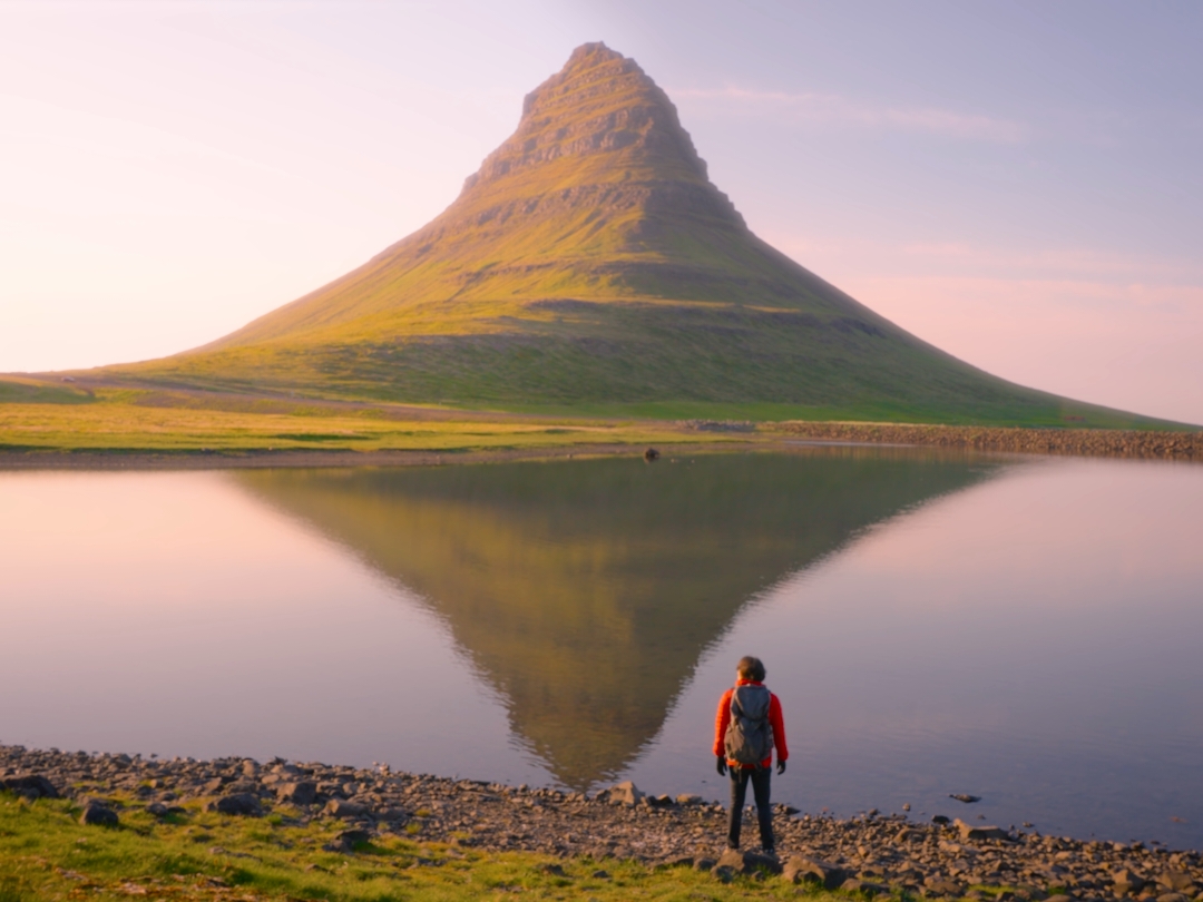 A perfect mountain. Witnessing the midnight sun setting over Kirkjufell is a surreal experience. The perfect shape of the mountain bathed in golden hues creates an unforgettable spectacle. 📍Kirkjufellfoss, Iceland #kirkjufell #kirkjufellfoss #iceland #icelandtravel #midnightsun #travelwbobby #traveltiktok #cinematic #sonyfx3 