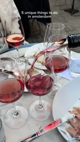 5 fun & unique things to do in Amsterdam! 🤍🍷🧺💐🎞️ #AmsterdamHotspots #AmsterdamEats #MustTryAmsterdam #HiddenGemsAmsterdam #ExploreAmsterdam #amsterdamguide 