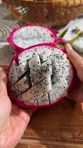 How to Cut Dragon Fruit Dragon fruit is a delicious, low-calorie fruit that’s great for weight management. It’s high in fiber, helps regulate blood sugar, and is packed with vitamin C, iron, and calcium. it’s super beneficial for your body! If the dragon fruit is bright and even in color, feels slightly soft like an avocado, and has drying spines, it’s most likely ripe and ready to eat. Here’s how to cut it: 	1.	Wash the dragon fruit. 	2.	Cut it in half. 	3.	Score the flesh inside the skin. 	4.	Score crosswise to create small pieces. 	5.	Eat with toothpicks or scoop out with a spoon. #dragonfruit #cuttingfruit #howtocutdragonfruit #helthyfood #hacks #lowcalorie #highfiber #weightmanagement #yummyfruit 