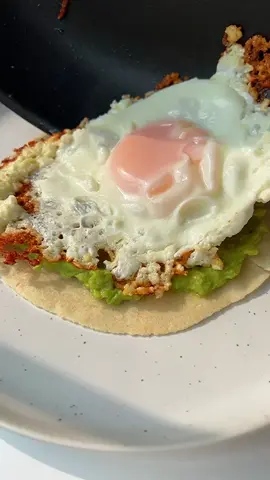 ✨Viral Feta Fried Eggs✨ Once you try these 5-minute feta fried eggs 🍳, you’ll understand why this recipe is going viral on social media. This genius dish is heavily inspired by @graceelkus on Instagram, and it will be your new favorite five-minute breakfast or snack. This recipe is remarkably adaptable, allowing you to personalize it as much as you’d like. You can experiment with a number of crumbly, salty cheeses, going beyond traditional feta. When it comes to the vehicle for this cheesy dish, both corn and flour tortillas are excellent options. Ingredients ⅓ cup feta 1 egg, large ½ avocado salt, to taste 1 teaspoon lemon juice 1 6-inch tortilla, (any variety: corn, flour, nut-based) 1 teaspoon chives, chopped  https://themodernnonna.com/viral-feta-fried-eggs/ #friedeggs #eggrecipe #viralrecipe #eggs #feta #breakfast #recipetok #FoodTok 