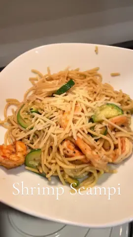 My take on an easy Shrimp Scampi🍤  1 box spaghetti 2 Zuchinni 1 tsp chili flakes  10oz shrimp 2 tablespoons garlic herb butter 1/2 cup parmesan Salt & Pepper to taste  I also recommend adding some lemon juice to your serving 🍋 #dinnertime #DinnerIdeas #easydinner #quickdinner #shrimppasta #shrimpscampi #foodtiktok #foodies #pastatiktok 