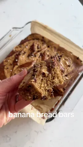 HEALTHY BANANA BREAD BARS 😍🍌🍫 We had an early morning flight last week on our way to Florida and I wanted to bring a healthy snack with us to eat on the plane. Usually on road trips we pack overnight oats for breakfast, but I googled it and it said you couldn’t take overnight oats through TSA.  Sooo I used similar ingredients to make these high protein banana bread bars and they were DELICIOUS!! Made with healthy ingredients and sweetened with honey and bananas, these are the PERFECT healthy breakfast (or snack/dessert/anytime treat) that you will love!  I used @promix vanilla whey protein for this recipe - it’s my favorite protein powder because it’s made with clean ingredients! You can use the discount code ✨CLAIRE✨ for 15% off Promix!  Makes 12 bars: ~191 calories, 10g protein, 5g fat, 29g carbs each  Ingredients:  - 2 cups oats (use gf if needed)  - 3 servings vanilla protein powder (I use @promix vanilla whey protein - use code ‘CLAIRE’ for 15% off!) - 1 tsp baking soda  - 1/2 tsp baking powder  - 1/2 tsp salt  - 1 tsp cinnamon  - 3 very ripe bananas  - 2 eggs  - 1/4 cup honey (or maple syrup)  - 1/3 cup almond milk (sub for any milk)  - 2 tsp vanilla extract  - 1/2 cup chocolate chips (I use enjoy life mini choc chips) - Optional: natural peanut butter for swirling on top!  How to:  - Preheat oven to 350F. Line an 8x8 dish with parchment paper.  - Add the oats to your blender and blend into oat flour.  - Add the oat flour, vanilla protein powder, baking soda, baking powder, salt and cinnamon to a large bowl and stir to combine.  - In a second bowl add ripe bananas and mash well. Add eggs, honey, milk and vanilla extract then whisk until well combined.  - Pour the wet ingredients into the dry ingredients and stir to combine, then fold in chocolate chips.  - Spread batter into the baking dish (swirl peanut butter on top if you want) and bake for 25-30 mins until a toothpick comes out clean (25 mins was perfect for me)  - Let cool then slice into 12 bars and enjoy! #healthyrecipe #EasyRecipe #bananabread #bananabreadbars #highprotein #cleaneating #healthyeating #mealprep #mealprepbreakfast #healthydessert #glutenfreedessert #travelbreakfast 