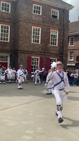 Ebor Morris Dancers in York 🕺🏼 Morris dance, ritual folk dance performed in rural England by groups of specially chosen and trained men; less specifically, a variety of related customs, such as mumming, as well as some popular entertainments derived from them. Similar customs are widespread throughout Europe and extend to the Middle East, India, and parts of Central and South America. Notable examples are the Perchten dancer-masqueraders of Austria, the ritual dances such as the moriscas (or moriscos), santiagos, and matachinas of the Mediterranean and Latin America, and the călușari of Romania. The wide distribution of such dances suggests an ancient Indo-European origin. A common feature of many of them is that of a group of dancing men attendant on a pagan god who celebrates his revival after death. Often the dancers wear white clothes and dance with bells fastened to the legs or body. A feeling that the dances have magic power or bring luck persists wherever they are traditionally performed. #morrisdancing #folkdance #dancing #folk #morrisdancers #follow #wassail #folkmusic #bordermorris #mummers #tradition #folklore #morrisdancer #oldways #mayday #devon #cider #herefordshire #folktraditions #morris #greekdancing #dancingonice #hauntology #morrisdancersofengland #fun #dancer #ancienttraditions #mm #mumming #dancersoftiktok #yorkshire 