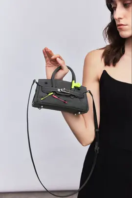 Mini but mighty. 💣 This small denim punk bag packs a punch with its bold safety pin details and versatile design. A perfect companion to our larger version, it’s all about making a rebellious statement, no matter the size. 🔥 #MiniRevolution #DenimPunk #HXXXXS