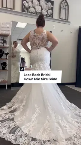 Loving this lace bridal gown thats fitted and features a low back.  #midsizefashion #midsizebride #mermaidweddingdress #lacebridalgown #weddingplanning #dressshopping 