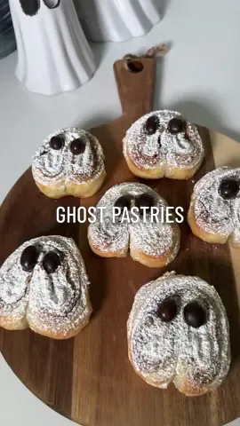 Pastry ghosts 👻 Lay out thawed pastry sheet Spread whatever filling you'd like, l used cookie butter Lay another sheet of pastry  Cut and shape into hearts upside down Top with egg wash and cinnamon sugar (optional) Bake at 400 for 10-12 minutes Top with powdered sugar and peanut mms for eyes 👻 🤍 Tip: Soak your skewers in water before so they don't burn #halloween2021 #halloweentreat #ghost #pastry 