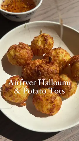 Air Fryer Crispy Halloumi & Potato Tots 🥔 🧀 (Serves 2 - 468 calories)    I never get bored of eating halloumi but added to potatoes to make these hash brown balls, unreal! I served them with some hot honey, but you could also dip them into chilli jam for a nice kick.    Ingredients:  300g potatoes  100g halloumi  30g cornflour  Olive oil   Hot honey or chilli jam to serve (optional)    Method:  1. Boil the potatoes whole, skin on for 10 minutes so they are softish.    2. Once fork tender, drain the potatoes and leave them to cool. Then grate them using the coarse side of a grater. Likewise, grate the halloumi.    3. To a bowl, add the grated halloumi, potatoes, cornflour and season to taste (I used salt and pepper but you can use whatever spices you like). Mix well with your hands until all the ingredients are well combined.    4. Make balls with the palms of your hands. Transfer to your air fryer and brush some olive oil or rapeseed oil over each hash brown bite.    5. Air fry the halloumi hashbrown bites for approximately 12-15 minutes at 200 or until nice and golden. Serve with some hot honey or chilli jam and get stuck in.    #airfryer #airfryermeals #meals #airfryerrecipe #airfryerrecipes #Recipe #recipes #halloumi #hashbrown #hashbrowns #halloumibites #halloumirecipe #halloumirecipes #viral #viralrecipes #trending   #food #Foodie #potato #potatoes  #tiktok #fyp #foryou