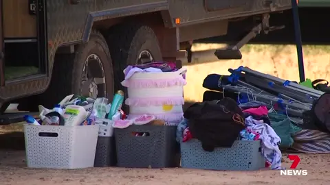 A young family of five has jumped from their moving caravan after it was stolen while they were asleep inside. Witnesses say the children's screams alerted them to the brazen heist at the outback Queensland campsite. #7NEWS
