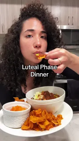 Turkey Chili with a side of carrot salad and sweet potato chips ✨ Perfect for the luteal phase. Here’s why: 1. Hormone Regulation - Turkey: Lean protein & tryptophan support serotonin production and stabilize mood. - Carrots: High in fiber and beta-carotene, helping to eliminate excess estrogen.  2. Nutrient-Rich Meal - Sweet Potatoes: Rich in vitamins A & C, reducing inflammation and supporting skin health. - Carrots: Provide additional fiber & vitamin A for hormone balance. 3. Blood Sugar Stabilization - Sweet Potatoes: Complex carbs stabilize blood sugar, preventing mood swings & energy crashes. 4. Anti-Inflammatory Benefits - Turkey: Contains selenium, reducing inflammation & easing luteal phase symptoms. - Carrots: Rich in antioxidants that reduce inflammation. 5. Digestive Health - Chili Spices: Aid in digestion & reduce bloating. - Carrots: High fiber supports a healthy digestive system.  6. Mood and Energy Boost: - Turkey & Sweet Potatoes: Provide steady energy, helping to combat fatigue. Ingredient: - 1lb lean ground turkey  - 3 garlic cloves, minced  - 1/2 yellow once diced  - 1 15oz can tomato sauce  - 1 14.5oz can diced tomatoes  - 1 7oz can diced green chili  - 1 15oz can kidney beans (drained & rinsed) - 1 15oz can black beans (drained & rinsed ) - 2tbsp chili powder - 2tsp cumin  - 1/2tsp black pepper - Sea salt to taste  - 2tsp garlic powder - 1 tbsp coconut sugar  Garnish  -Green onion -Raw cheddar cheese  #lutealphase #hormoneimbalance #turkeychili #chili #healthydinner #cyclesyncing #cooking #recipes #healthyrecipes #comfortfood #Foodie 