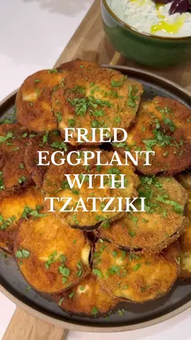 This fried eggplant recipe brings back memories of cherished family gatherings. The scent of eggplant sizzling in olive oil, the crispiness of each golden slice, evoke a sense of warmth and togetherness.  INGREDIENTS  • 3 eggplants • 1 cup (120 g) of all-purpose flour • 3 eggs • 3 cups (180 g) of breadcrumbs  • pepper • Extra virgin olive oil (for frying) INSTRUCTIONS  • Wash and slice the eggplants into 1/3-inch (0,80 cm) thick rounds. • In a bowl, mix the flour and thevblack pepper • In another bowl mix the eggs • In another bowl add the breadcrumbs  • Dredge each eggplant slice in the flour mixture, ensuring it's well-coated on both sides. Shake off any excess flour. • Then add the eggplant slice in the egg mixture • Then add it in the breadcrumbs  • Heat about 1/2 inch (1,5 cm) of olive oil in a large frying pan over medium heat. • Once the oil is hot, add the eggplant slices in batches. Avoid overcrowding the pan. • Fry each slice for about 4-5 minutes per side, or until golden brown and crispy. • Remove the fried eggplant and place them on a plate lined with paper towels to drain excess oil. • Sprinkle with fresh chopped parsley for extra flavor. • Serve the fried eggplant warm with a side of tzatziki sauce for dipping. • Enjoy your crispy Greek fried eggplant! TZATZIKI RECIPE • 1 2/3 cups (400 g) of Greek yogurt  • 2-3 grated garlic cloves  • 3 Tbsp of extra virgin olive oil • 3 Tbsp of red vinegar  • 2 Tbsp of chopped dill • 1 tsp salt • pepper  • 3 grated and drained small cucumbers  #friedeggplant #eggplant #tzatziki #greekcuisine🇬🇷 #cooking #learnintiktok #alexandrashome #fypシ゚viral 