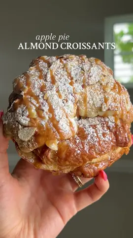 APPLE PIE ALMOND CROISSANTS The epitome of fall 🍂 Recipe below OR go to my website through the link in my bio 🤎  #Recipe Details (makes 4 large, 8 mini): - 4 large or 8 mini croissants, a day or two old - Powdered sugar, for topping - Sliced almonds, for topping Apple Pie Filling: - 2 large apples of choice, peeled and cut into 1” pieces (I used Granny Smith) - 2 tbsp salted butter - 2 tbsp brown sugar - 2 tbsp maple syrup - 1/2 tsp cinnamon - 1/2 tsp apple pie spice (sub: additional cinnamon) Almond Filling: - 10 tbsp salted butter, softened - 2 eggs - 2 cups almond flour @Bob’s Red Mill  - 1 cup granulated sugar  - 3 tsp almond extract - 2 tsp vanilla extract - 1/2 tsp salt Simple Syrup: - 1 cup sugar - 1/2 cup water *Recipe for salted caramel is on my website through the link in my bio Instructions: Preheat the oven to 330F. Line a baking sheet with parchment paper; set aside. Start by preparing the apple pie filling. In a medium skillet over medium heat, melt the butter. Then, add the apple pieces, brown sugar, maple syrup, cinnamon, and apple pie spice. Mix until the apples are coated and the brown sugar is melted. Allow to simmer for 3-5 minutes, until the apples are just slightly cooked and the mixture is glossy. Set aside. Prepare the simple syrup by heating the sugar and water together in a small pot on the stove, just until the sugar is dissolved into the water. Set aside. Prepare the almond filling. Mix together all of the ingredients for the almond filling in a medium bowl, until well combined. Transfer the mixture to a piping bag or a ziplock baggie with the corner snipped off. Set aside. Assemble the croissants. Slice the croissants in half, and place them onto the prepared baking sheet. Brush the bottom half of each croissant generously with the simple syrup. Spoon or pipe half of the almond filling onto the bottom halves of the croissant (reserving the rest of the almond filling for topping). Divide the apple pie filling among the croissants, placing it on top of the almond filling.  Place the tops on top to close all of the croissants. Brush the tops of the croissants with more simple syrup. Then, generously spoon or pipe the rest of the almond filling on top, and sprinkle with sliced almonds. Bake at 330F for 40-45 minutes until they are golden. Allow to cool slightly. Then dust with powdered sugar, and drizzle with salted caramel, if desired. Enjoy! #apple #applepie #applepiecroissant #applepiealmondcroissant #almond #almondcroissant #almondcroissantrecipe #croissant #croissants #fall #fallrecipe #easy #EasyRecipe #Breakfast #brunch #snack #dessert #baking #fallbaking #fallbreakfast #falldessert @From Our Place @Costco Wholesale @Jem 