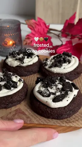 Frosted Oreo cookies 🖤🤍 Ingredients for 6 large cookies - 1/2 cup butter, softened - 1/3 cup light brown sugar - 1/4 cup granulated sugar - 1 large egg - 1 tsps vanilla extract - 1 cup all-purpose flour - 1/2 tsp baking soda - 1/2 tsp salt - 1/4 cup cocoa powder Oreo Cream Cheese Frosting - 1/4 cup butter, softened - 50g cream cheese - 1 tsp vanilla extract - 30g whipped crram - 30g powdered sugar - Oreos, for garnish Directions Cookies: - Preheat oven to 175°C, and line a baking tray with parchment paper. Set aside. - Mix dry ingredients together. - In a seperate bowl, beat together the butter + sugars until white & fluffy, mix in egg and vanilla extract. - Carefully fold in the dry ingredients until just combined. - Scoop dough and place on prepared baking sheet. - Bake at for 12-14 minutes or until cookies no longer look doughy in the center. Cool completely on the pan. Frosting: Beat the all the ingredients together until combined. Top the cookies with the frosting. Crush up some Oreo cookies and sprinkle them on top. Enjoy! 🥰 Folllow @izzyskitchen_ for more recipes! 🤍 #oreos #frostedoreocookies #cookiesandcream #aestheticbaking #bakingvideo #cookiesofinstagram #cookiestagram #crumblcookies #crumblcookiecopycat 