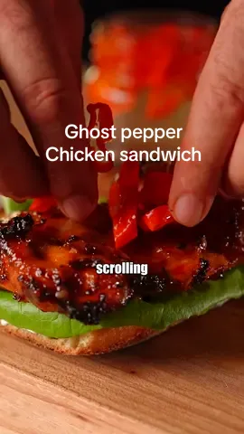 Ghost pepper chicken sandwich 👻🎃 Is it me or does it just feel like fall already. Maybe that’s why I thought it was a good idea to put ghost peppers on my sandwich ( which I may never do again 🥵). Fall and Halloween are my favorite times of the year, and I’ve actually never made a Halloween type sandwich so congratulations you’re here for the first one ever! Let me just mention that when you’re feeling the need to watch a scary movie, try and find the berserk anime it’s really good! Follow for free ghost peppers 👻🌶️ ✨recipe ✨Chicken marinade Take your chicken thigh or breast and get it in a bowl add 🌱Light mayo 🌱Light sour cream  🌱Paprika  🌱Garlic powder  🌱Onion powder 🌱Salt and pepper  Mix and then get it in your air fryer and cook for 16 minutes flipping half way through. Cook till an internal of 165F is reached. Then coat in a sweet and sour sauce ( Chicken 150 Calories , marinade 141 Calories ) ✨Ghost pepper pickles Slice up a ghost pepper ( wear gloves ) and get them in a container. Next in a pot add a 1 to 1 ratio of water and vinegar and 1/2 a cup of sugar. Heat till sugar is melted and add to the jar with the peppers let cool and refrigerate. ✨bottom spread Light sour cream and chives (this sandwich is hot so this was needed) (sour cream calories added in the marinade calculation) ✨Ciabatta bread ( 115 calories ) ✨total 456 calories #ghostpepper #chickensandwich #sandwich #lowcalorie