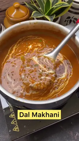 Dal Makhani Step-by-step recipe: • Wash and rinse 1 cup urad dal (whole black lentil) and 1/4 cup Rajma (kidney beans) • Soak in 4 cups water overnight. • Drain and transfer the dal and rajma to a pressure cooker. • Add whole spices(2 bay leaves, 1 inch cinnamon stick, 4 green cardamom, 2 black cardamom, 4 cloves) and salt. • Add 4 cups of water and cover the lid. • Pressure cook for 6-7 whistles. • Let the pressure release naturally. Keep it aside. • Heat oil in a pot, add butter. • Add 2 chopped onions and saute them until it turns light golden brown. • Add 2 tbsp ginger garlic paste, sauté until the raw smell goes away. • Add 1 tbsp Kashmiri red chilli powder and 1/2 tsp turmeric powder. Mix well and sauté for a minute. • Add 1 cup tomato purée and mix. • Add salt and cook until the oil separates. • Add 1 tbsp coriander powder, 1 tsp cumin and 1 tsp garam masala powder. Mix everything well and sauté for two minutes. • Add in the boiled dal and mix. Cook for 10 minutes. • Add water. Mix well and simmer the dal uncovered for 15-20 minutes. Keep on stirring often. • Add butter, 1/2 tsp kasuri methi, 2 chopped green chillies, some ginger julienne and 2 tbsps cream. Mix everything. • In a separate pan, add butter. Once it begins to melt, add chopped garlic, fry for few seconds until it turns golden brown. Add 1 tsp Kashmiri red chilli powder and add it straight to the dal. Give it a good mix. • Garnish with some chopped coriander leaves and cream. • Serve hot with naan, paratha, roti or rice. #dalmakhani #maakidaal #punjabi #food #foryou 