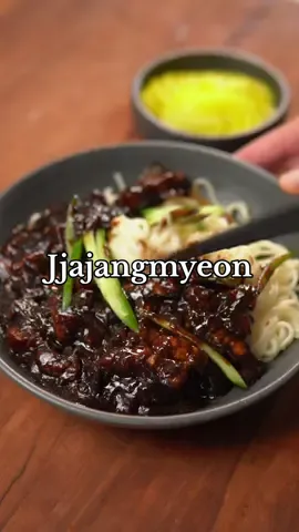 Jjajangmyeon Ingredients - 3 tbsp neutral oil - 3/4 cup Korean black bean paste - 1 lbs pork belly(sliced) - 1 cup onion(diced) - 2 tbsp garlic(minced) - 1 tbsp ginger(minced) - 1 cup zucchini(diced) - 1 tbsp oyster sauce - 1 tsp gochugaru - 2 tbsp sugar - 1 tsp black pepper - Msg/salt to taste - 2 cups dashi stock or beef stock - 3 tbsp cornstarch+3 tbsp water - 2 tsp sesame oil - Jajang noodles - Cucumber for garnish(julienned) - Korean pickled radish Instructions 1. Fry black bean paste with oil on medium low heat for 10 minutes. 2. In a pot, fry the pork belly on medium heat until browned and the fat has rendered. 3. Add onions, garlic, and ginger and sauté until fragrant and translucent(3-4 minutes). 4. Add zucchini and cook for a couple of minutes. 5. Add the cooked black bean paste and season with oyster sauce, gochugaru, sugar, and pepper, and msg. 6. Once incorporated, pour in stock, and let it simmer for 8 minutes. 7. Combine 2.5 tbsp water with 2.5 tbsp of cornstarch to make slurry. 8. Add slurry and let thicken on medium heat then drizzle sesame oil to finish. 9. Cook noodles 1 minutes less than package instructions. 10. Pour jjajang sauce over noodles, garnish with cucumbers, and serve with pickled radish. #jjajangmyeon #30minutemeals #jajangmyeon #Recipe #cooking #food #Foodie #recipevideo #cookingvideo #foodvideo #EasyRecipe #EasyRecipes #easyrecipeideas #quickrecipe #quickrecipes #quickrecipeideas #koreanfood #comfortfood #noodles #blackbeannoodles #recipetutorial #cookingtutorial 