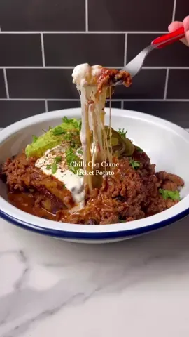 The best Chili Con Carne Recipe Ingredients: 800g lean beef mince  500g lean diced beef 2 tbsp olive oil 1 large onion, finely chopped 4 cloves garlic, minced 2 tbsp taco seasoning about 1 packet chili con carne seasoning 3 bay leaf 1 tsp meat tenderizer (optional) 1 tbsp chili lime seasoning 1 tsp chilli powder  1 tsp Bardia all-purpose seasoning 1 tbsp dried oregano 1 can (400g) chopped tomatoes 2 tbsp tomato purée 2 tbsp chicken stock powder 1/2 tsp flavor enhancer (optional) Salt and pepper to taste 1 tbsp brown sugar  Optional toppings: guacamole sour cream, grated cheese, cilantro, lime wedges Instructions: Prepare the Base: Heat olive oil in a large pot over medium heat. Add the chopped onions, minced garlic and cook until softened, about 5-7 minutes until fragrant. Cook the Meat: Add the ground beef and diced beef to the pot, breaking it up with a spoon as it cooks. Cook until the meat is browned all over. Season the Meat: Add the taco seasoning, chili con carne seasoning, Bardia all-purpose seasoning, chili lime seasoning, oregano, chilli powder, chicken stock powder, bay leaf, and meat tenderizer to the meat. Stir to coat the meat evenly in the seasonings. Add Tomatoes: Stir in the chopped tomatoes, 1 cup of water and tomato purée. Cook for about 5 minutes to allow the flavors to meld. Add the flavor enhancer if using, along with brown sugar, salt and pepper to taste. Simmer: Reduce the heat to low, cover the pot, and let the chili simmer for 30-40 minutes, stirring occasionally. The sauce should thicken and the flavors will develop as it cooks. Taste and Adjust: After simmering, taste and adjust the seasoning if necessary. If the chili is too thick, you can add a little more chicken stock. If it’s too thin, let it simmer uncovered until it reaches your desired consistency. Serve: Serve the chili hot, on a jacket potato with your choice of toppings like sour cream, guacamole, grated cheese, cilantro, or a squeeze of lime juice. #foryoupage #spud #jacketpotato #potato 