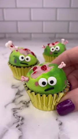 Little monsters.. big brains 🧠 💚 How cute are these little brainiacs 🧠🩷 How I made them 💁🏼‍♀️ 💚 For the brains 🧠 I dipped walnuts in pink chocolate and let them set. 💚 I added them to my silicone cake pop mold. 💚 I piped coloured buttercream dots around the sides of the mold and popped them in the freezer for 10 minutes. 💚 I then added two toned green buttercream into the mold, pressed my mini cupcakes on top and froze for further 20 minutes. 💚 I pushed them out of the mold and decorated with wiltoncakes Halloween eyes and bones, a sprinkle for the mouth 👄 and blood on the brain 🧠  #cupcake #minicake #halloweenbaking #spookyseason #bakinginspo #cakedbyrach #cupcakeart #monsters