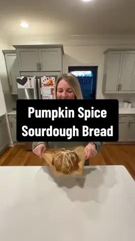 You will LOVE this fall recipe!!🫶🏼🍂  Pumpkin Spice Sourdough Bread 125g active starter 200g pumpkin purée  50g maple syrup  275g water 500g flour 1 TBSP pumpkin pie spice  12g salt 1. In a mixing bowl, add active sourdough starter. 2. Add pumpkin purée, maple syrup, and warm filtered water. Mix until the starter is dissolved. 3. Add flour, pumpkin pie spice, and salt. Mix until the dough is the same consistency and there are no pockets of dry flour remaining. Stretch and Folds: 4. Cover the dough and let it rest for one hour. 5. Perform stretch and folds every 30 minutes for four rounds. I do coil folds for the last 3 sets.  6. After the fourth round, cover the dough and let it bulk ferment on the counter for two hours until it increases by 50%-75% in size. 7. Generously flour the counter.  8. Shape the dough into a rectangle, then fold one side toward the middle, and repeat with the other side. Roll up your dough into a ball shape. Shape it into a round ball by pushing your dough out in a circular motion and pulling in about 3-4 times (tucking in the underside). Let rest for 20 minutes. 9. Perform the final shaping by repeating the steps you did in the first shape. Place your dough upside down (seam side up) into a floured banneton. 10. Cover your dough with a kitchen towel or plastic wrap and cold-proof in the refrigerator for 2 hours or overnight.  11. Preheat oven to 500°F with Dutch oven inside.  12. Place 4 equal sized butcher’s twine on top of dough. Add parchment paper and flip dough over.  Tie strings to make 8 equal parts and cut above the knots.  13. Place the dough with parchment paper into the preheated Dutch oven. 14. Bake covered at 500°F for 35 minutes, then uncover and bake for another 10 minutes at 425°F. Enjoy!😊 #sourdoughbread #pumpkinbread #fallrecipes #sourdoughtok 