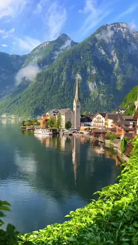 ARENDELLE IS REAL 🥹❄️👇 📍 Hallstatt, Austria feels like the real-life inspiration for the kingdom of Arendelle in Frozen!  🏔️ The lakeside village of Hallstatt is arguably the most beautiful place to visit in Austria. Hallstatt’s fairytale-like appearance has made it a bucket list destination for people across the world. Tips for visiting:  ☃️ Arrive early to enjoy the serene beauty before the crowds. Hallstatt can get very crowded depending on the time of year you go so we highly recommend getting there as early as possible if you want to avoid the crowds. We were there for sunrise and had an incredible experience.  Things do do: 🚠 Take the funicular up to the Skywalk for panoramic views that echo Arendelle’s majesty.  🏰 Explore the charming streets. Every corner has so much character. It felt like we were literally in a scene from the movie!  🧊 Visit the Hallstatt Salt Mine for a touch of adventure and historical depth. We didn’t have time to do this one but have heard it’s worth a visit!  ⚓️ Take a boat tour on Lake Hallstatt. Enjoy a scenic cruise on the lake for beautiful views of the village and surrounding mountains.   💌 Send this to someone who would love to visit the real life Arendelle ✨ #hallstatt #hallstattaustria #austria #frozen #arendelle #frozenmovie #disneyfrozen 