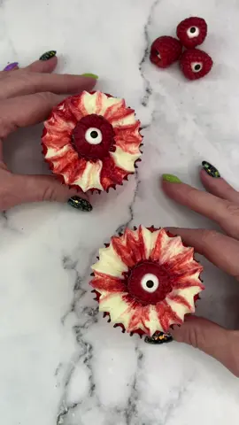 👀🩸 Raspberry eyes 🩸👀 Using the @wiltoncakes sultan tip to make some #spookytreats ♥️ I brushed my piping bag with lines of raspberry sauce mixed with red gel colour. I then filled it with vanilla buttercream 🧁 I added raspberry jam to the centre of the cupcake and topped it off with a raspberry eye (that’s a raspberry with a candy eye sat inside it) ♥️ #cupcake #HalloweenTreats #spookyseason #cakedecorating #bakinginspo #cakedesign #cakedbyrach #eyeballcupcakes 