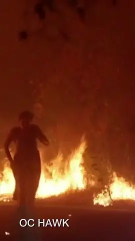 A woman runs from the flames as a fire truck saves her from the Orange County fire. #california #wildfires 