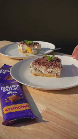 YOUR FAVE CHOC CHEESECAKE SQUARES 🤤 INGREDIENTS Base: 1 packet (100g) Lu Tuc Salted Biscuits 1⁄2 cup (115g) butter, melted Filling: 3 tubs (230g each) full-fat cream cheese, softened and at room temperature 1⁄4 cup icing sugar 1⁄4 cup whipping cream 2 (80g each) Cadbury Dairy Milk Crunchie Slab, chopped Topping: 2 (80g each) Cadbury Dairy Milk Crunchie Slab, chopped METHOD STEP 1: Line a square 20cm baking dish with baking paper. Crush the Lu Tuc Salted Biscuits into fine crumbs and mix with the melted butter until well combined. STEP 2: Use a spoon to press the biscuit mixture evenly into the prepared baking dish to form the base. Refrigerate while preparing the filling. STEP 3: In a large bowl, beat the cream cheese and sugar until smooth and creamy, then add the cream and beat until well combined. STEP 4: Add the chopped Cadbury Dairy Milk Crunchie Slabs and fold in until evenly distributed. STEP 5: Pour the cream cheese mixture over the chilled biscuit base and spread evenly. Sprinkle the chopped Crunchie Slabs evenly over the filling. Cover the baking dish with cling wrap and refrigerate overnight to set. STEP 6: Once set, cut into 9 squares and ENJOY! #ad #nobakecheesecakes #yourfavechoccheesecakesquares #sahalessabakes #sahalessacooks #sahalessa #Foodie 