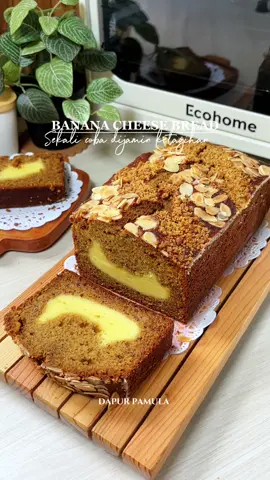 Bismillah ❤️ Nyesel banget baru coba banana cheese bread ini rasanya enak banget ternyata😋😋 bikin nya juga gampang anti gagal pokoknya kalian yang suka baking wajib banget coba deh, atau pemula yang mau belajar bikin kue resep ini di jamin anti gagal 🥰🥰  Dan aku panggang nya menggunakan ELECTRIC OVEN PLATINUM 24 L dari @Ecohome Indonesia  ✅ Kapasitas oven 24L ✅ Multifungsi karna ada fungsi Deyhydrate,Broil,Frost dan Roast  ✅ Dilengkap dengan Fan Convection yang membuat makanan matang merata  ✅ Daya mulai dari 150-800 watt  Yuk samaan🥰 💕BANANA CHEESE BREAD💕 @dapurpamula Bahan-bahan : 250 gr pisang 2 butir telur  65 gr palm sugar  45 gr gula pasir  200 gr tepung terigu 1/2 sdt baking powder  1/2 sdt baking soda  80 ml minyak  Bahan keju : 200 gr keju oles/keju spredy  30 gr gula halus 1 sdm tepung terigu 1 butir telur  1/2 sdt vanila  Cara Membuat : Cara Membuat : 1. Campurkan telur dan gula aduk hingga tercampur rata atau hingga gula nya larut 2. Masukan pisang yang sudah di lumatkan dan aduk hingga merata  3. Masukan terigu, BS dan BP jangan lupa untuk di ayak agar tidak ada bahan yang bergeridil  4. Tuang minyak goreng dan aduk hingga tercampur rata 5. Campurkan bahan untuk keju hingga tercampur rata 6. Tuang 1/2 adonan kedalam loyang kemudian tuang semua adonan keju tutup lagi dengan sisa adonan pisang,disini aku pakai loyang uk 22x10x7 cm yg di alasi dengan baking paper, beri toping sesuai selera 7. panggang dengan suhu 170°c api atas bawah selama -+45 menit atau hingga matang.  Happy Watching 💕  Selamat mencoba 😋  #bananabread #bananacheesebread #reseobananabread #cakepisang #electricovenecohome #electricovenplatinum #bananacake #caramembuatbananabread #bolupisang #tutorialbaking #olahanpisangkematangan #fyp
