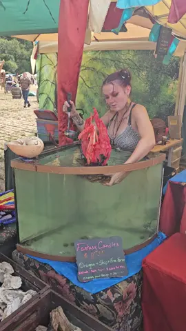 Dragon Candle at Shrewsbury Renaissance Faire.  #dragon #rennaissance #faire #foryoupage #paraffinwax #chainmail #cutehair #moons #candle #wax #fishtank #driftwood #gobigorgohome #colorful #unique 
