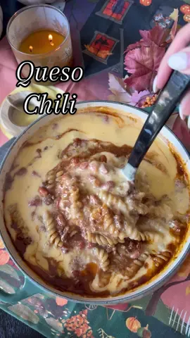Queso Chili!🍂🧀 One of my all-time favorite soup recipes, bringing it back from 2 years ago!! My husband isn’t even a big soup fan, but loves this!! Chili + Queso, you can’t really go wrong! Perfect for weeknight meals, or Sunday game-days! Used recipe from @togetherasafamily Ingredients * 2 tablespoons olive oil * 1 lb ground beef * 1 onion (diced) * Salt & Pepper * 2 cans (32 oz) beef broth * 2 cans (30 oz) pinto beans (drained) * 1 can (15 oz) petite diced tomatoes * 1 can (10 oz) condensed tomato soup * 4 teaspoons chili powder * 1 teaspoon cumin * 1 teaspoon garlic powder * 1/2 teaspoon dried oregano * 2 cups dry rotini pasta Queso Sauce * 2 tablespoons butter * 2 tablespoons flour * 1 teaspoon salt * 2 cups whole milk * 2 cups shredded cheddar cheese For Serving * Fritos corn chips * sour cream * shredded cheese * Green onions Directions:  1. In a large soup pot, add some olive oil and ground beef. Toss in diced onion, salt, and pepper. Brown and drain any excess grease.  2. Add beef broth, beans, tomatoes, soup, seasonings, and rotini. Bring to a boil and cook until noodles are soft.  3. In a saucepan, melt butter. Add the flour, whisking.  4. While still whisking, pour in salt and milk. Let this thicken, takes about 8 minutes on a low-medium heat. (Whisking every minute or so)  5. Add the cheddar cheese, and mix until fully melted.  6. Pour queso into chili, and mix together.  7. Serve with more shredded cheese, sour cream, green onion, and Fritos corn chips!  #soupseason #souprecipes #chilirecipe #fallrecipes #gamedayeats 