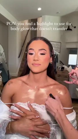 The never ending question for body glow: does if transfer??? Some can. Some do. It’s all how you apply it + how you set it! I have found with this specific one it seems to dry down completely after a few minutes so I don’t have to set it with powder. I do always set body glow with the @onesize setting spray no matter what! I think the key is also to not use a CRAZY amount of the highlighter! This is the @pinknovembers highlight in the shade Covet. I do have a code with them!! It’s EMILY15 🫶🏼❤️ #bodyglow #glow #bride #weddingmakeup 