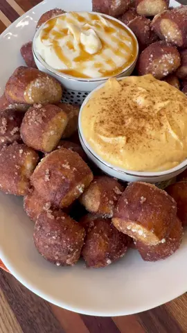 Cinnamon Sugar Pretzel Bites dipped in pumpkin and salted caramel cream cheese icing is easy to make and so good! INGREDIENTS  King’s Hawaiian Soft Pretzel Bites  4 tbsp melted butter  1/2 cup sugar 1 tbsp cinnamon  8 oz cream cheese 1 cup powdered sugar  1 tsp vanilla extract  1/4 cup pure pumpkin  Pumpkin pie spice  Caramel  1/2 tsp sea salt  INSTRUCTIONS  In a large bowl combine King’s Hawaiian Soft Pretzel Bites, 4 tbsp of melted butter, sugar, and cinnamon. Shake pretzel bites around in the bowl until they are well coated in cinnamon sugar.  Place King’s Hawaiian Soft Pretzel Bites on a sheet pan and bake in the oven following the directions on the package.  In a bowl combine cream cheese, vanilla extract, and powdered sugar. Use a hand mixer to mix everything together.  Separate the cream cheese icing into two smaller bowls. For the pumpkin cream cheese icing, add 1/4 cup of pure pumpkin and some pumpkin spice seasoning. Stir well.  For the salted caramel icing, add some caramel sauce and about 1/2 tsp of sea salt. Stir well.  Dip cinnamon sugar pretzel bites in cream cheese icing and enjoy!  #pretzelbites #kingshawaiian #dessert #EasyRecipes #pumpkin #seasaltcaramel 