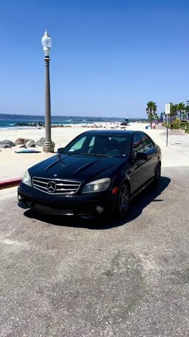 Black Widow @ the beach 🩵  • #c63 #giuliadrives #amg #carsoftiktok #coronado #socalcars #fyp #w204 #foryou 
