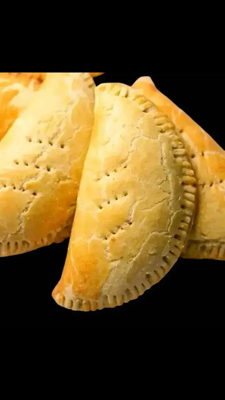 YOUR CRUNCHY EATERY MEAT PIE INGREDIENTS:  DOUGH 8 cups all-purpose flour 250g Butter 3 Eggs (1 for brushing) 1 teaspoon Salt 1 tablespoon sugar 1 teaspoon baking powder 1/4 cup (60ml) cold water  FILLING: 350g Ground beef 1 Potato, peeled and diced into small cubes  1 Large Onion, chopped 1 Large Carrot, peeled and diced 1 cup (240ml) Water/beef broth Salt to taste Pepper (optional) 1 teaspoon Thyme 2 tablespoons flour 2 tablespoons Oil Method: THE DOUGH  In a large bowl mix together flour, sugar(optional) salt and baking powder.  Add butter and rub it with the flour until you get a crumbly texture. -Beat 2 eggs and add it to the flour mixture, mix until dough is formed. Cover for 30mins.  THE FILLING In a large pan heat oil. Add onion and sauté for 5-6 mins.   Add the ground meat and fry for for 4-5 mins. Add the diced carrots, season with salt, pepper, thyme and flour. Divide the dough into 8 pieces. Roll out the dough into 1/8-inch thickness. Cut out a round shape with your desired sized.  Place about 1-2 tablespoons of the meat mixture in the center and fold over the dough using the meat meat-pie cutter or you can fold and use a fork to seal the edge. Poke the pies with a fork to create a steam outlet. Brush the pies with beaten egg. Bake for 25-30 minutes, until golden. Your crunchy  meat pie is set. #foryoupageシ  #expression  #dupsyluvd_creations 