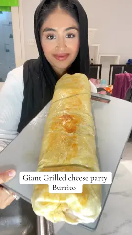 Still cant believe I rolled this entire thing up! But this is great if youre making mexican food and you dont want to spend hours rolling wraps for all your guests when you can just roll up a big fat one and then cut it into slices! #tacobell #grilledcheeseburrito #giantburrito #chipotle #jellybeansweets 