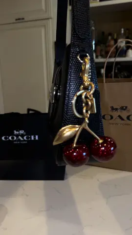 Got my hands on @Coach cherry charm 🍒✨ and just in time for @asheeboee concert jueves 10 ☔️🖤  #coach #juniorh #cherry #lacherry #charm #bagaccessories #concert #concierto #cherrycharm #purse #pursetok #keychain #coachny #fyp #coachbag #paratii #bolsadevalores #sadboyz #coachbag #cereza 