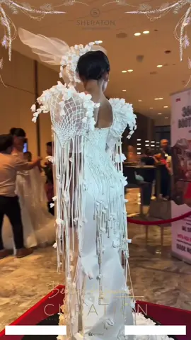 THE KNOT OF PROMISE  This Filipiniana gown tells a timeless blend of sophistication and cultural pride . The gown features three distinct design elements: the net, the sampaguita, and the pearls . The knotted net symbolizes the victory of challenges, where each macrame cords represents strength and unity through adversity . The national flower, the sampaguita, crafted from excess fabric, signifies an unbreakable promise as the two couples say: I’ll be with you for better, for worse, for richer, for poorer, in sickness and in health, to love and to cherish, until parted by death. Lastly, the pearls, some sourced from vintage 'ukay-ukay' dresses, embody pure, everlasting love. each detail a symbol of love, purity, and commitment, weaving together a beautiful tapestry of promises yet to unfold. Designer: Hermosa John Lloyd Mentored by @Lemuel E Rosos  Video by:@iSpy360 Videobooth  Model: @@kim_hsiri on ig #stacymodelsmanagement  #getlemuelized #getlemulized #fashion #beyondhappinescuration #sheratonmactan #sheraton #filipiana #pearl #sampaguita #knot #wedding #curation #philippines #cebu 