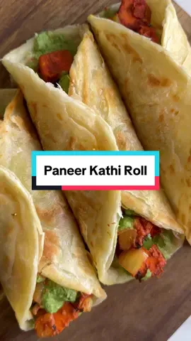 Paneer Kathi Rolls  I LOVE paneer so much 🥹🥹 Recipe (makes 4) - 250g paneer - 1 green pepper - 1 large onion - 30g fresh coriander  - 2-3 tbsp yoghurt - 2 tsp garlic ginger paste - 1/2 lemon, juiced - 1 tsp ground coriander - 1 tsp ground cumin - 1/2 tsp turmeric powder - 1 tsp red chilli powder (or to taste) - 1/4 tsp red food colour (optional) - 1/2 tsp salt (or to taste) Green chutney recipe: - Handful of coriander (40g approx) - 10 fresh mint leaves - 2 green chillis - 1 clove garlic - 1 tsp cumin seeds - Few tbsp water to blend - Salt to taste - 1-2 tbsp Greek yoghurt (after blending) Method 1. Mix together yoghurt, garlic ginger paste, spices and lemon juice. 2. Add in diced onion, peppers, paneer and fresh coriander 3. Allow to marinate for 2-3 hours or cook right away 4. Add 2 tbsp oil into a pan, once hot add marinated paneer mix 5. Cook for 6-7 minutes or until liquid has evaporated and veg is slightly soft but still crunchy (keep mixing to avoid sticking) 6. Cook frozen paratha according to packet instructions or use roti/tortilla wrap 7. For green chutney blitz together all ingredients below, optional to add yoghurt to make more mild or use as it for a spicy chutney 8. Build rolls, add chutney and paneer mix, optional salad, roll and enjoy! #paneer #kathiroll #indianfood 