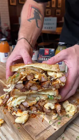 BBQ Pork Rib Toastie 🫡 We start with a base of a mozzarella toastie then add: • Bacon jam • BBQ pork ribs (deboned)  • Proper meat sauce • Mac’n’cheese • Onion rings • Parsley (for health) Myself, chef @johnrelihan and the good folks at @pittbrosbbq have put our heads together to bring you some of the best sandwiches to ever grace the city of Dublin. The third of which is this BBQ Pork Rib Toastie that has most of the @pittbrosbbq menu in it.   This is the one that started it all a few months ago when I cooked it up with a gift basket that Pitt Bros kindly gifted me. It was too good not to go on as a special and I’m so glad you guys can try it now. It will be available on the @pittbrosbbq lunch menu starting on Thursday the 21st of October so get yourself down and grab yourself a proper Bitta Banging 🤝 #fyp #food #Foodie #foodblogger #FoodTok #sandwich #collab #bbq #ribs #macncheese #add #chef 