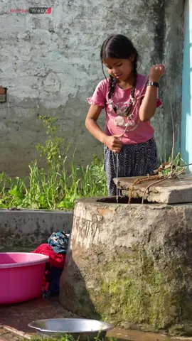 Journey to Simplicity: Girl Drawing Water from a Village Well in Nepal #Nepal #Village #Well #Simplicity #Tradition #Culture #Heritage #DailyLife #Rural #Timeless #History #Community #Lifestyle #Water #Nature #Serenity #Civilization #Journey #OldWorld #Innocence #foryou #fyp #explore 