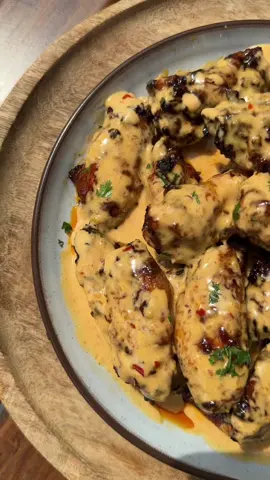Who can resist the irresistible flavours of Nando’s. I know I can’t. I’ve recreated these Nando’s style Creamy Peri -Peri wings in a spicy, tangy and creamy sauce. You can use this recipe for chicken pieces as well, it’s so good. Enjoy. Ingredients: For the Marinade: - 1 kg chicken wings  - 1/4 cup Portuguese seasoning @weberbraaisa  - 2 tbsp lemon juice - 3 tbsp Nando’s sauce - 2 tbsp honey - 2 tbsp olive oil - 1 tbsp smoked paprika - Salt and pepper to taste For the Creamy Sauce: - 1 tbsp butter - 1/2 cup cream - 3 tbsp Nando’s sauce Instructions: 1. Marinade Preparation:  - In a bowl, combine Portuguese seasoning, lemon juice, Nando’s sauce, honey, olive oil, smoked paprika, salt, and pepper.  - Mix well.  - Coat the chicken wings evenly with the marinade.  - Marinate for at least 2 hours or overnight for maximum flavor. 2. Air Fryer Cooking:  - Set the air fryer to 200°C.  - Place the marinated wings in the air fryer basket.  - Air fry for 20-25 minutes, flipping halfway through, until golden and cooked. 3. Creamy Sauce Preparation:  - In a saucepan, melt 1 tbsp butter over low heat.  - Stir in cream and 3 tbsp Nando’s sauce.  - Simmer until well combined and slightly thickened. 4. Optional Braai (Grill) Cooking:  - Preheat the grill to medium-high (around 200°C).  - Grill the marinated wings for 25-30 minutes, turning occasionally, until cooked through and charred. 5. Optional Oven Cooking:  - Preheat the oven to 200°C.  - Place the marinated wings on a baking sheet and bake for 30-35 minutes or until crispy, turning once. The Final Touch:  - Pour the creamy sauce over the cooked wings before serving. #Nandos #Nandosrecipes #Nandoschicken #chickenrecipes #periperichicken 