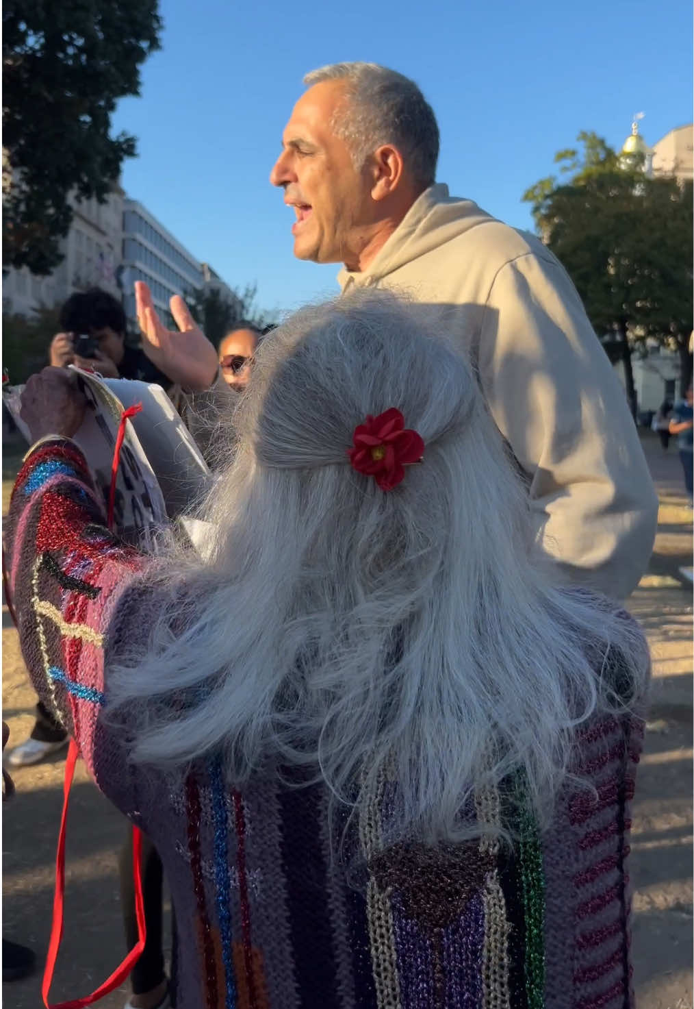 Israeli man interpreted the vigil for Palestine while they attemtped to read the names of 11 year olds killed in Gaza. He proceeded to argue with Holocaust Survior Marione Ingram. He was ultimately asked to leave by police. 